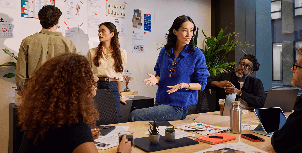 A group of people in the meeting room